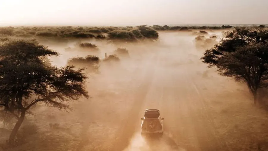 A 4x4 convoy in desert dust